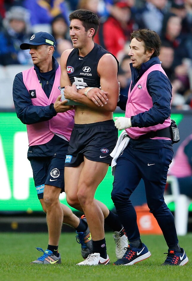 AFL 2016 Rd 06 - Carlton v Essendon MELBOURNE, AUSTRALIA - MAY 1: Jacob Weitering of the Blues leaves the field injured during the 2016 AFL Round 06 match between the Carlton Blues and the Essendon Bombers at the Melbourne Cricket Ground, Melbourne on May 1, 2016. (Photo by Adam Trafford/AFL Media)